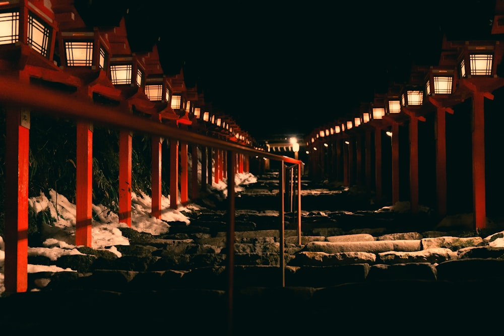 a row of lanterns lit up in the dark