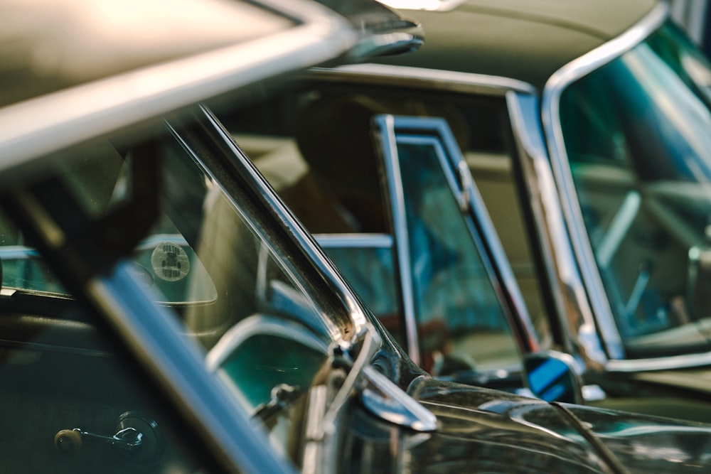 a row of old cars parked next to each other