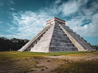 a large pyramid in the middle of a field