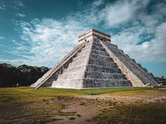 a large pyramid in the middle of a field