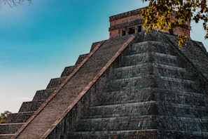 a large pyramid with a clock on top of it