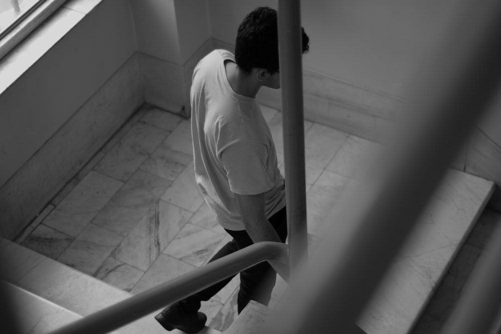 a man walking up a flight of stairs