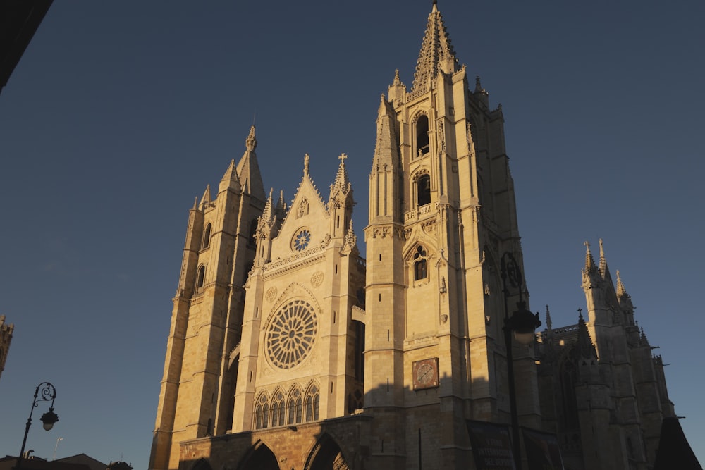 a large cathedral with a clock on the front of it