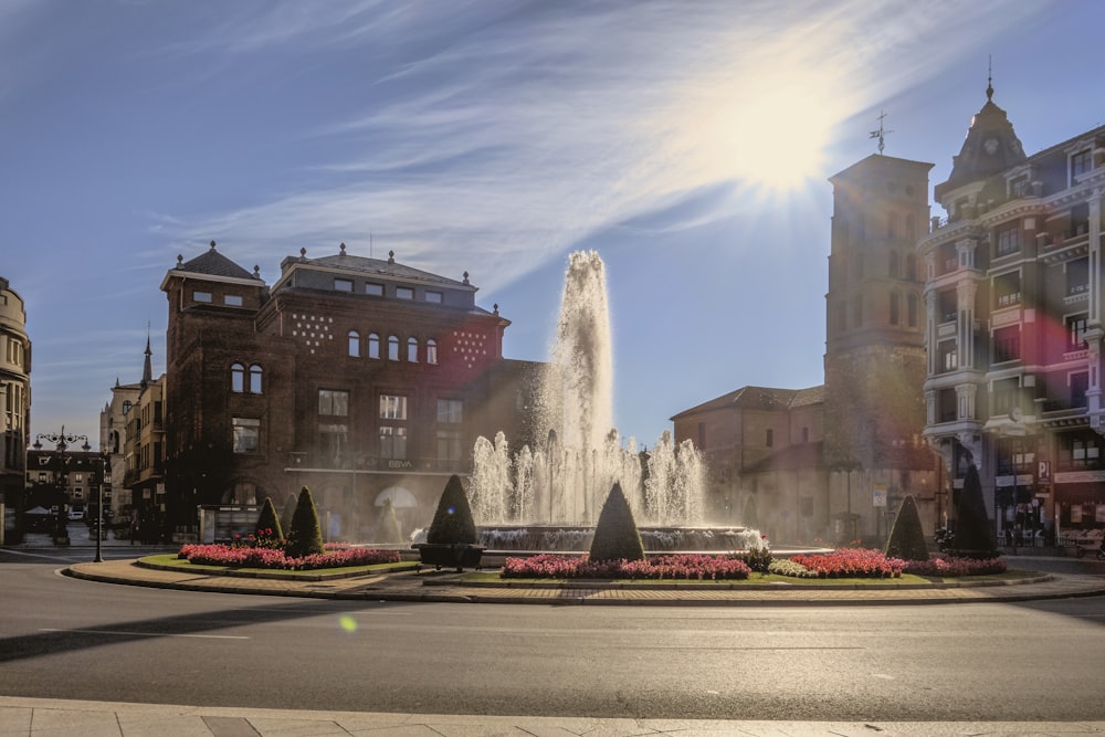 a fountain in the middle of a city square