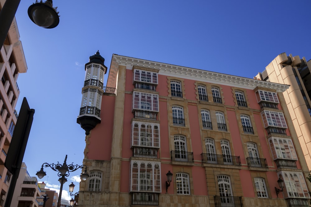 a tall building with a clock on the front of it