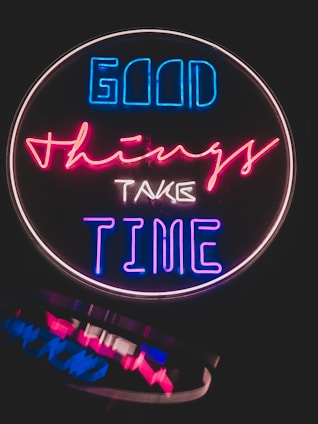 a neon sign that says good things take time