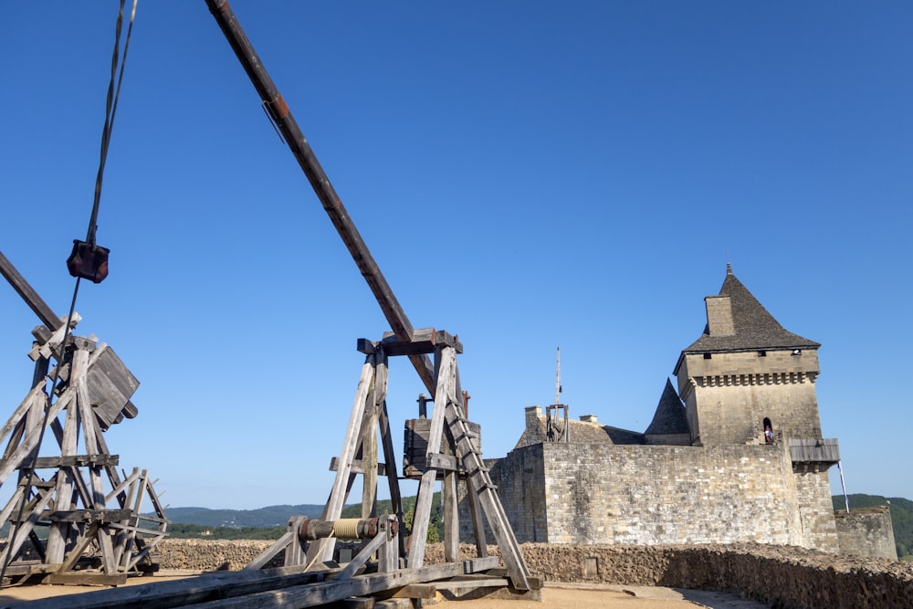 a couple of wooden structures sitting in front of a castle