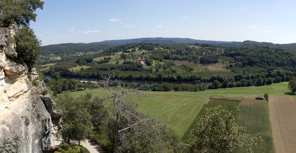 a view of a valley and a river from a cliff