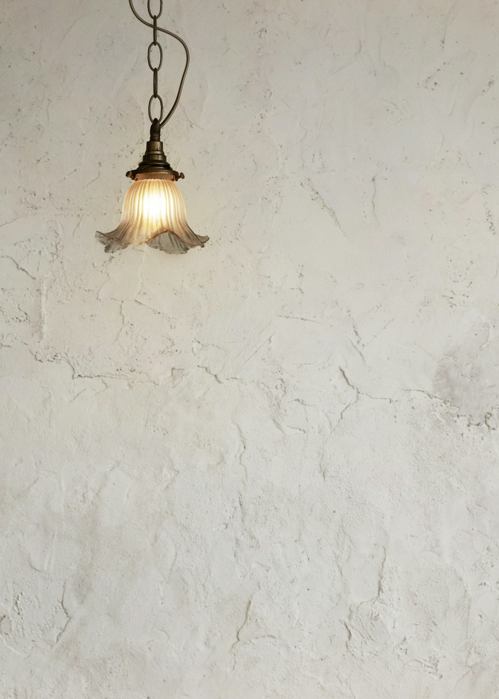 a light hanging from a ceiling in a room