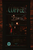 Warm amber lighting highlighting fossil-inspired wall art inside the café.