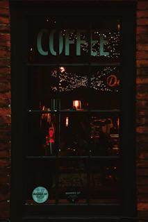 Warm amber lighting highlighting fossil-inspired wall art inside the café.