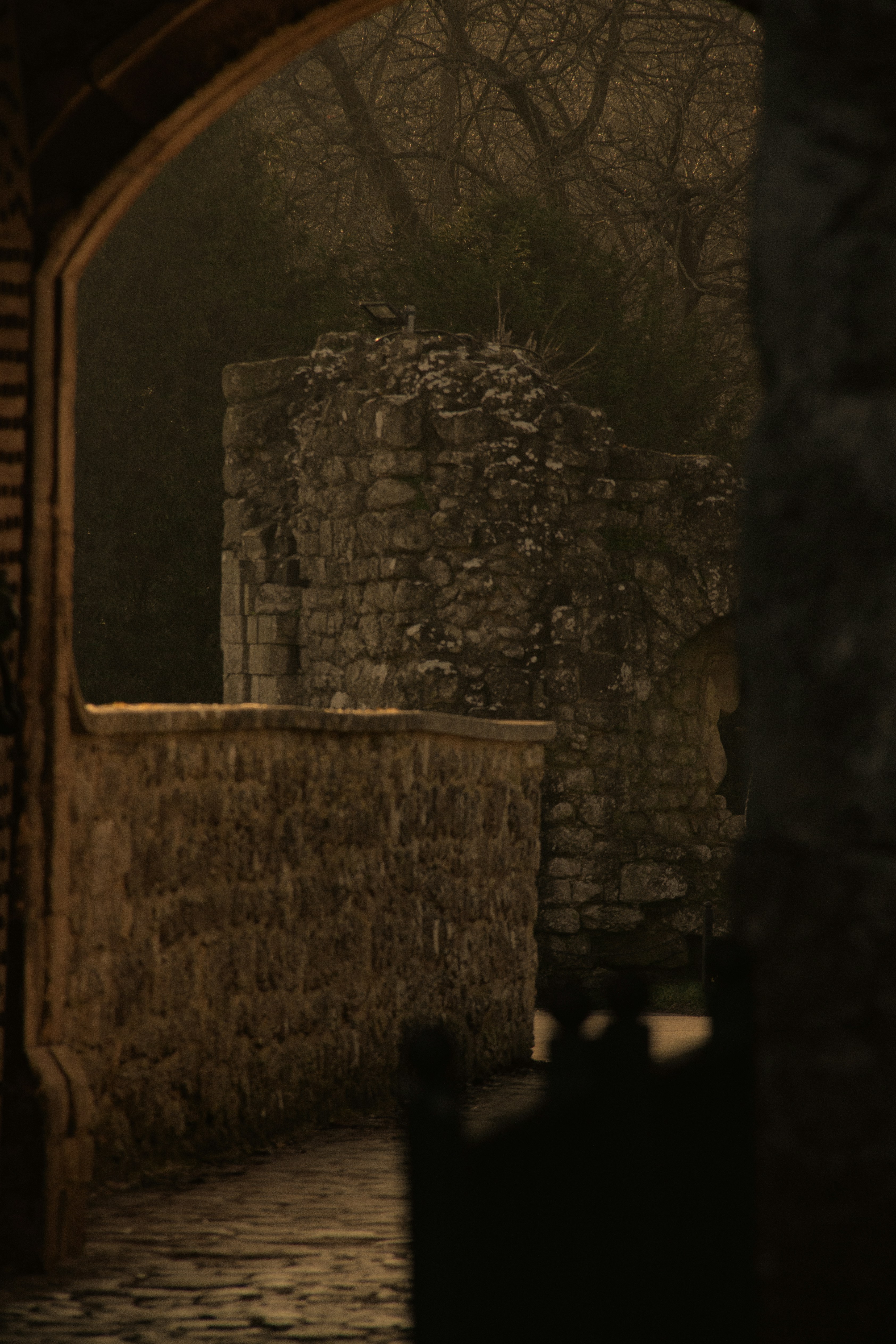 a stone building with a clock on top of it