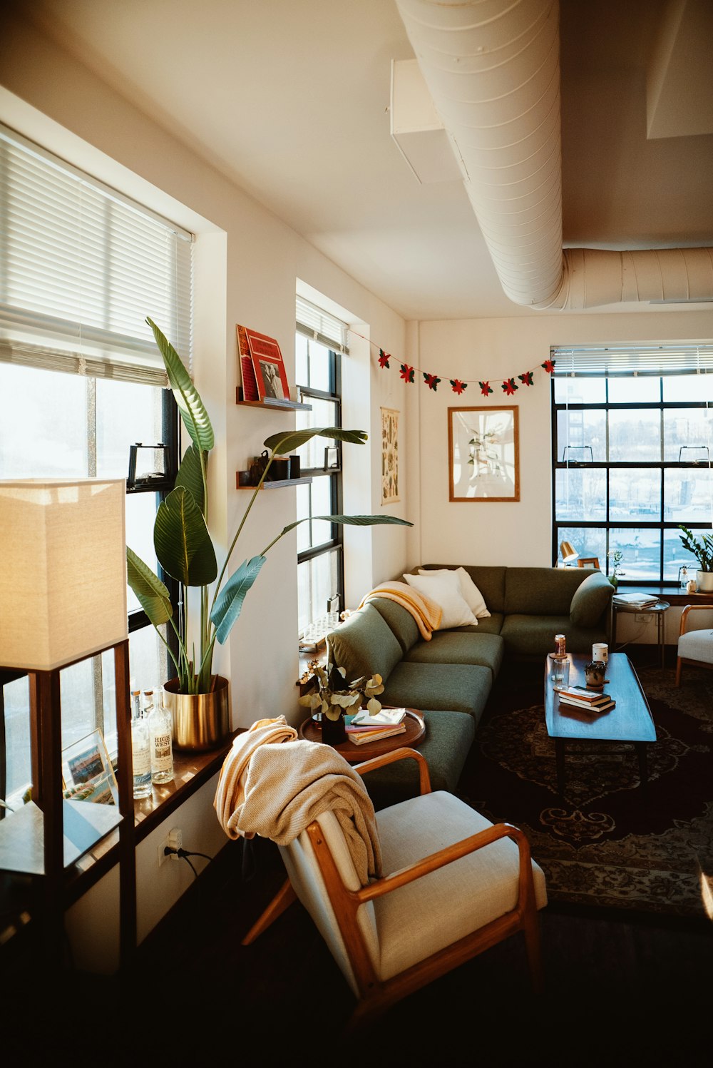 a living room filled with furniture and a large window