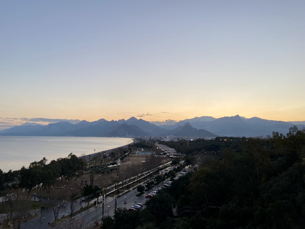 a view of a city with mountains in the background