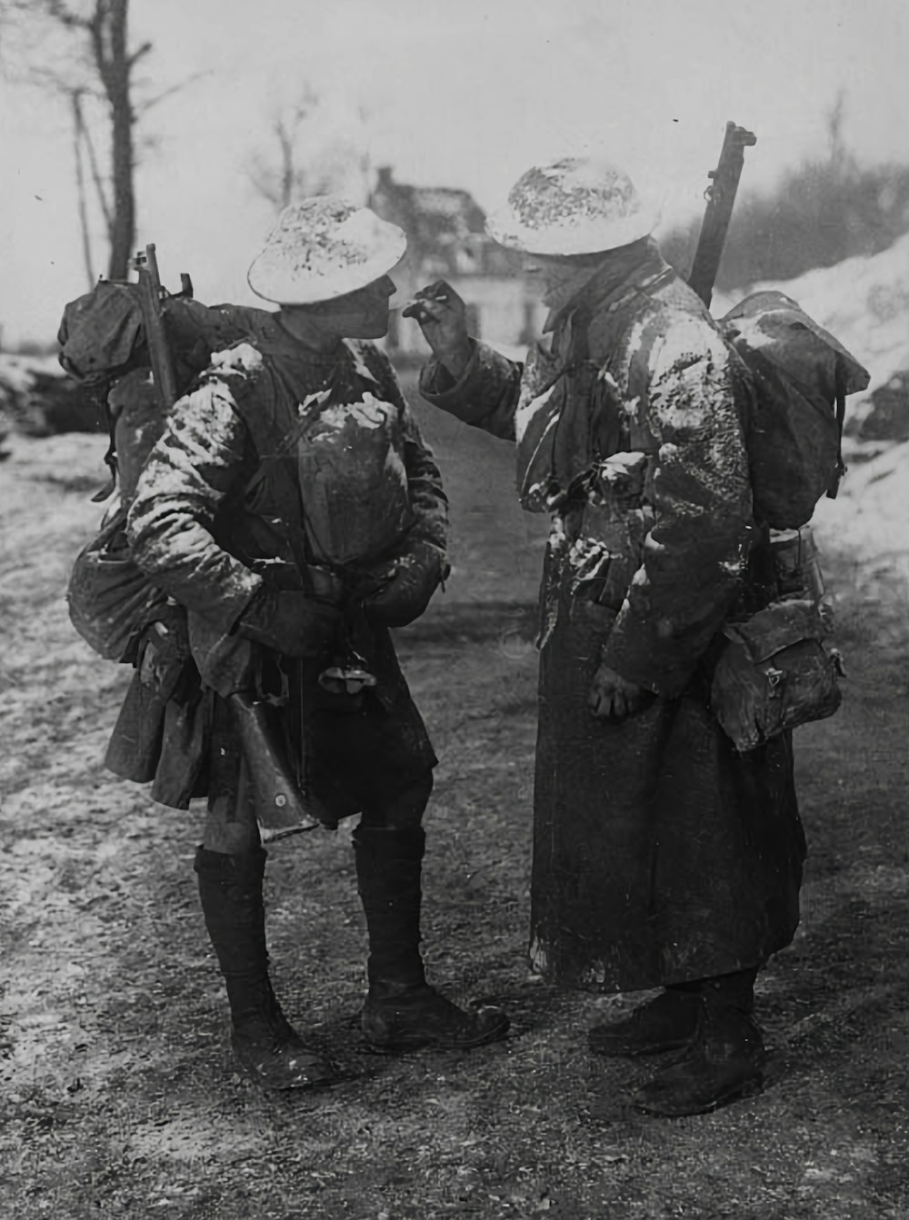 two men dressed in old time clothing standing next to each other