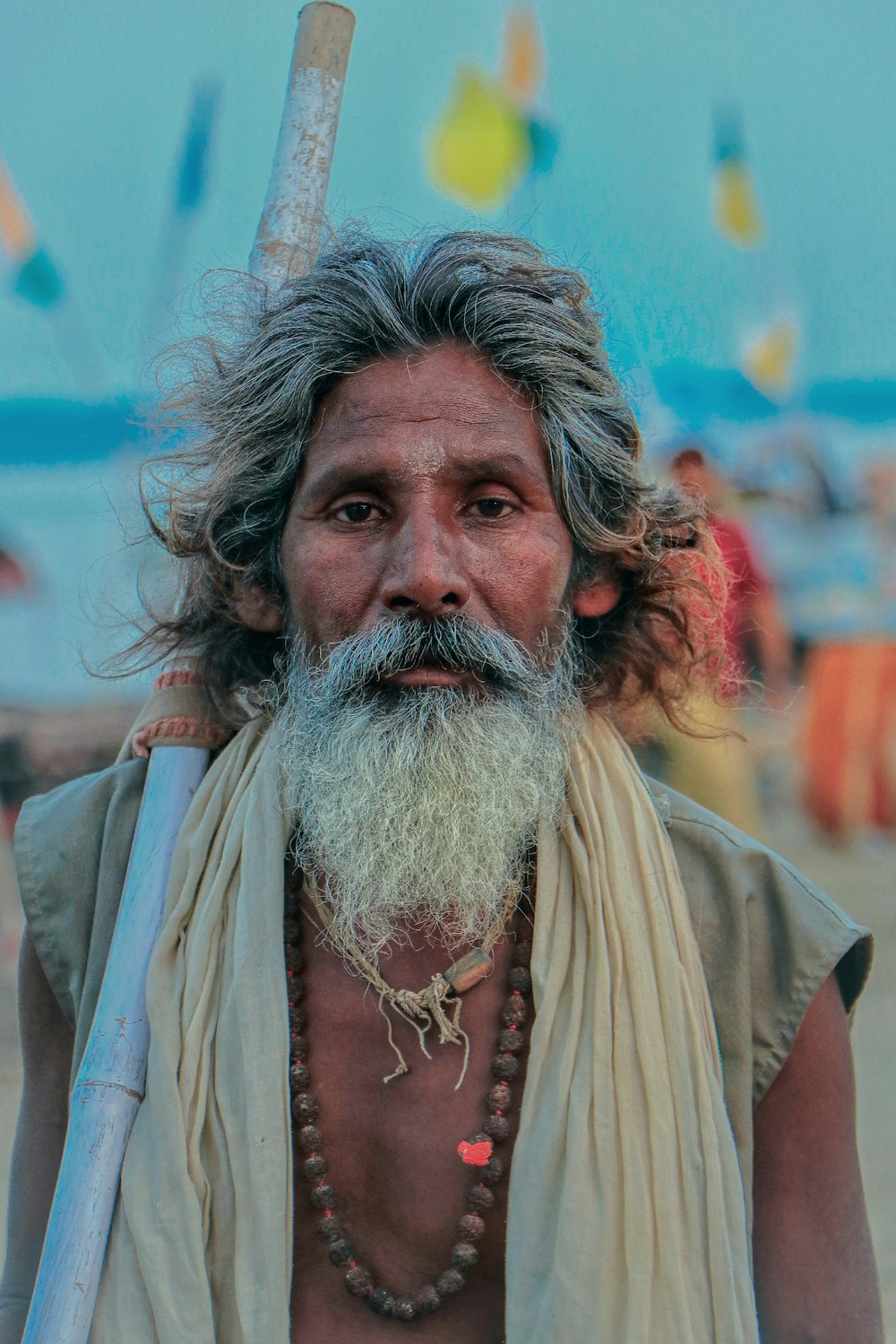 a man with a long beard holding a baseball bat photo – Free Prayagraj Image  on Unsplash