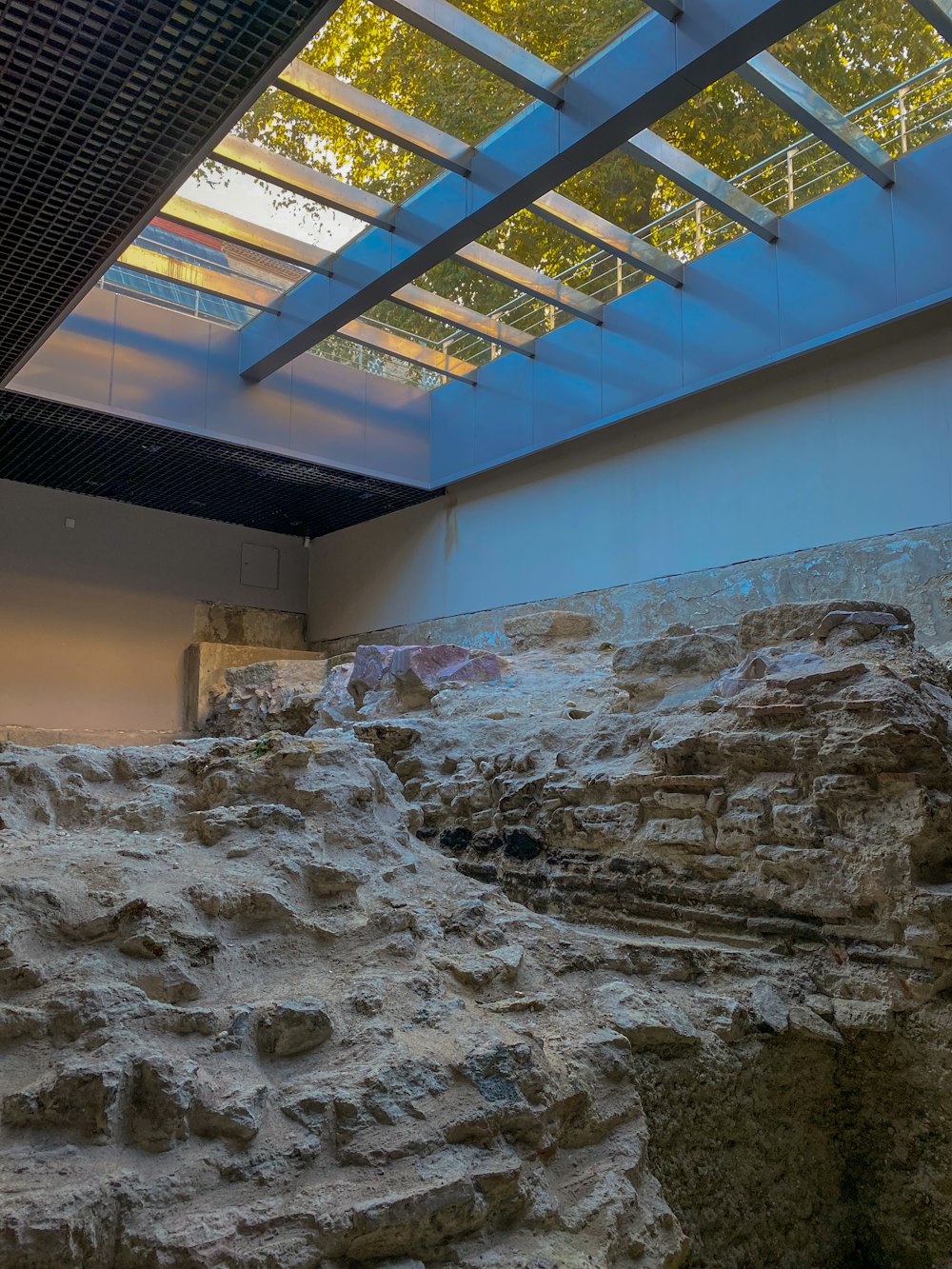 a large stone structure with a skylight above it