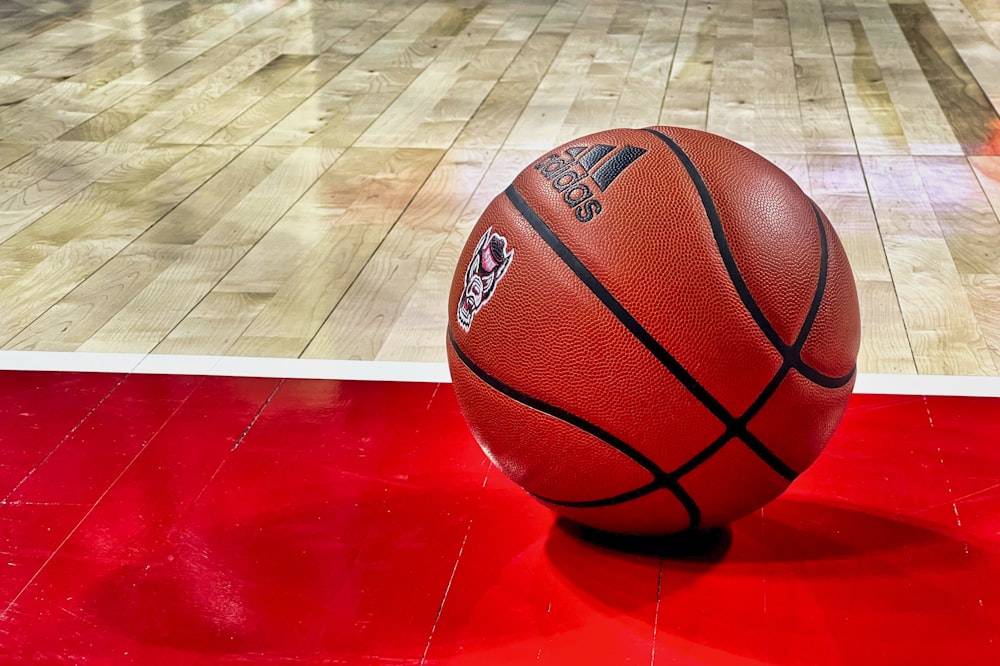 a close up of a basketball on a court