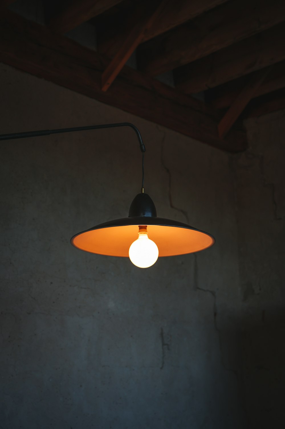 a light hanging from a ceiling in a room
