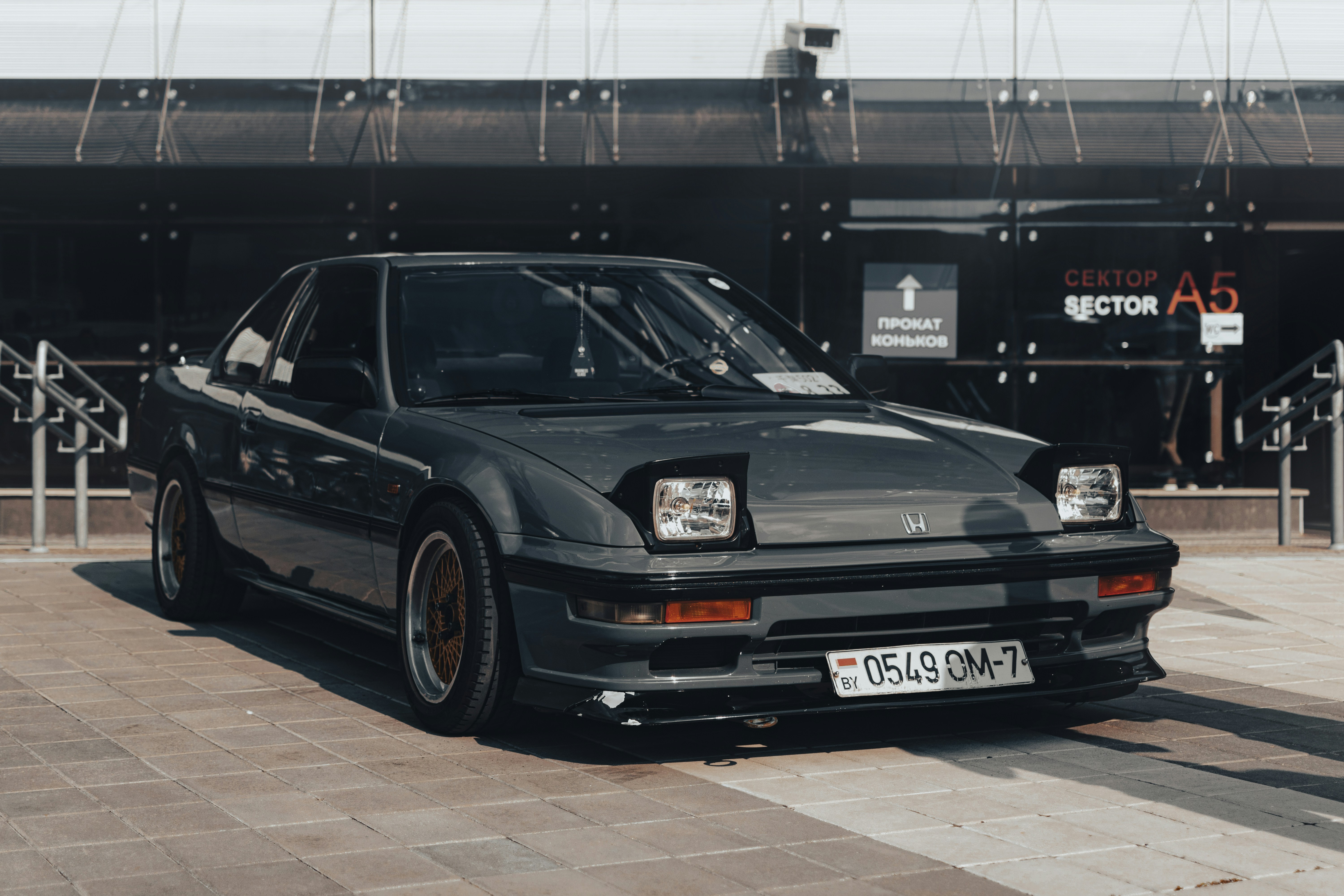 a black car parked in front of a building
