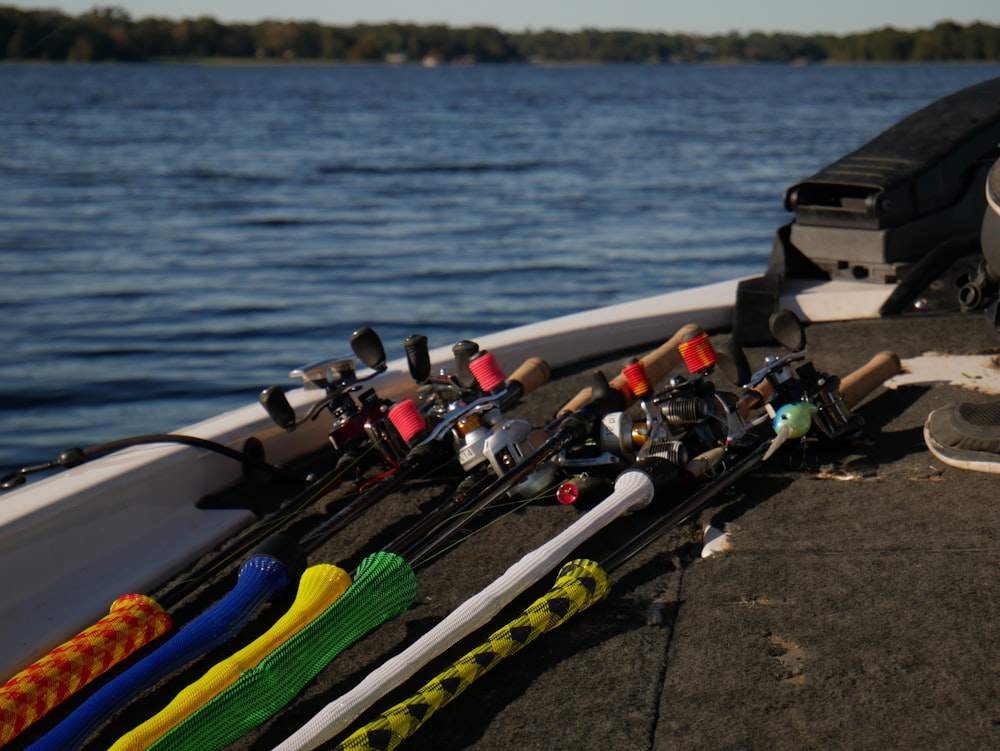 a row of fishing rods sitting on top of a boat