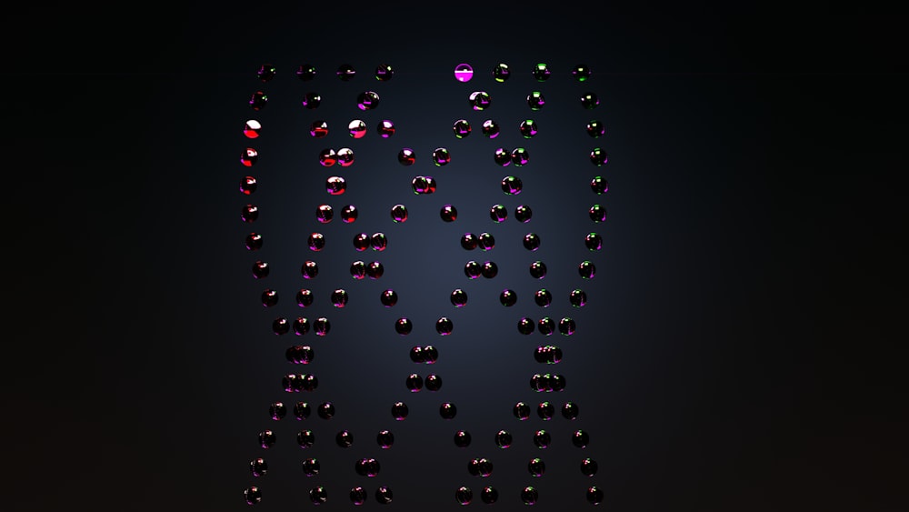 a group of different colored diamonds on a black background