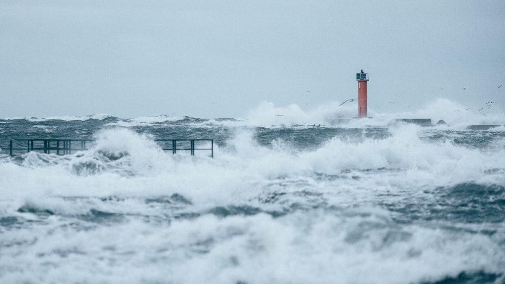 a lighthouse in the middle of a large body of water