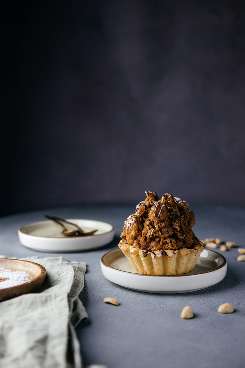 a muffin sitting on top of a white plate