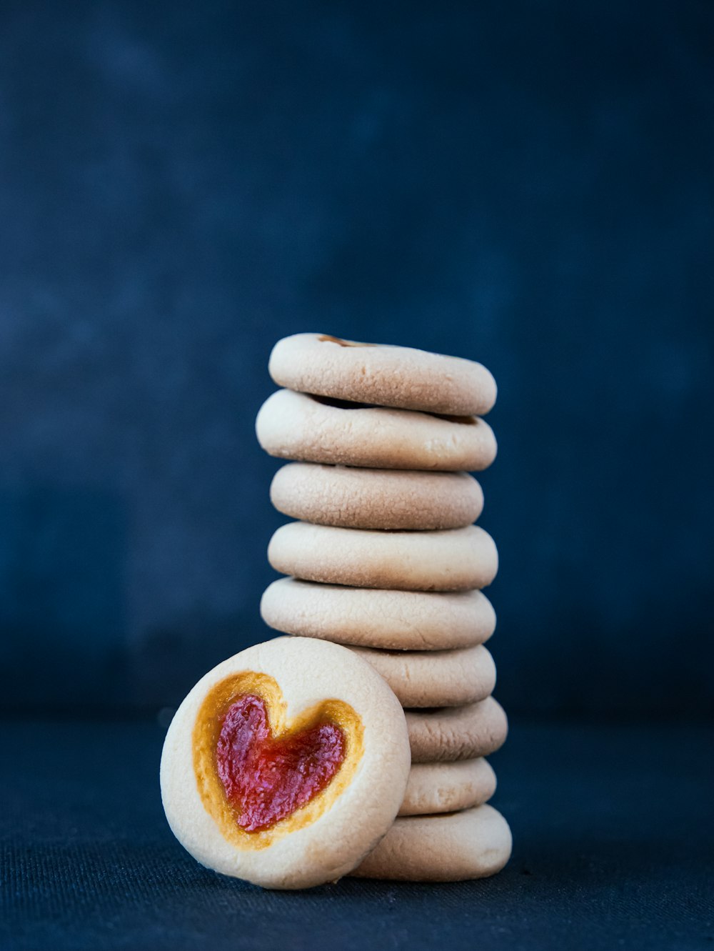 a stack of cookies with a heart on top