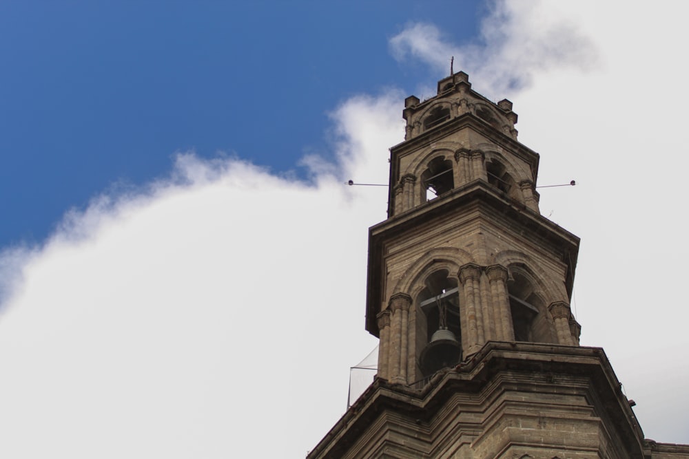 a tall clock tower with a sky background