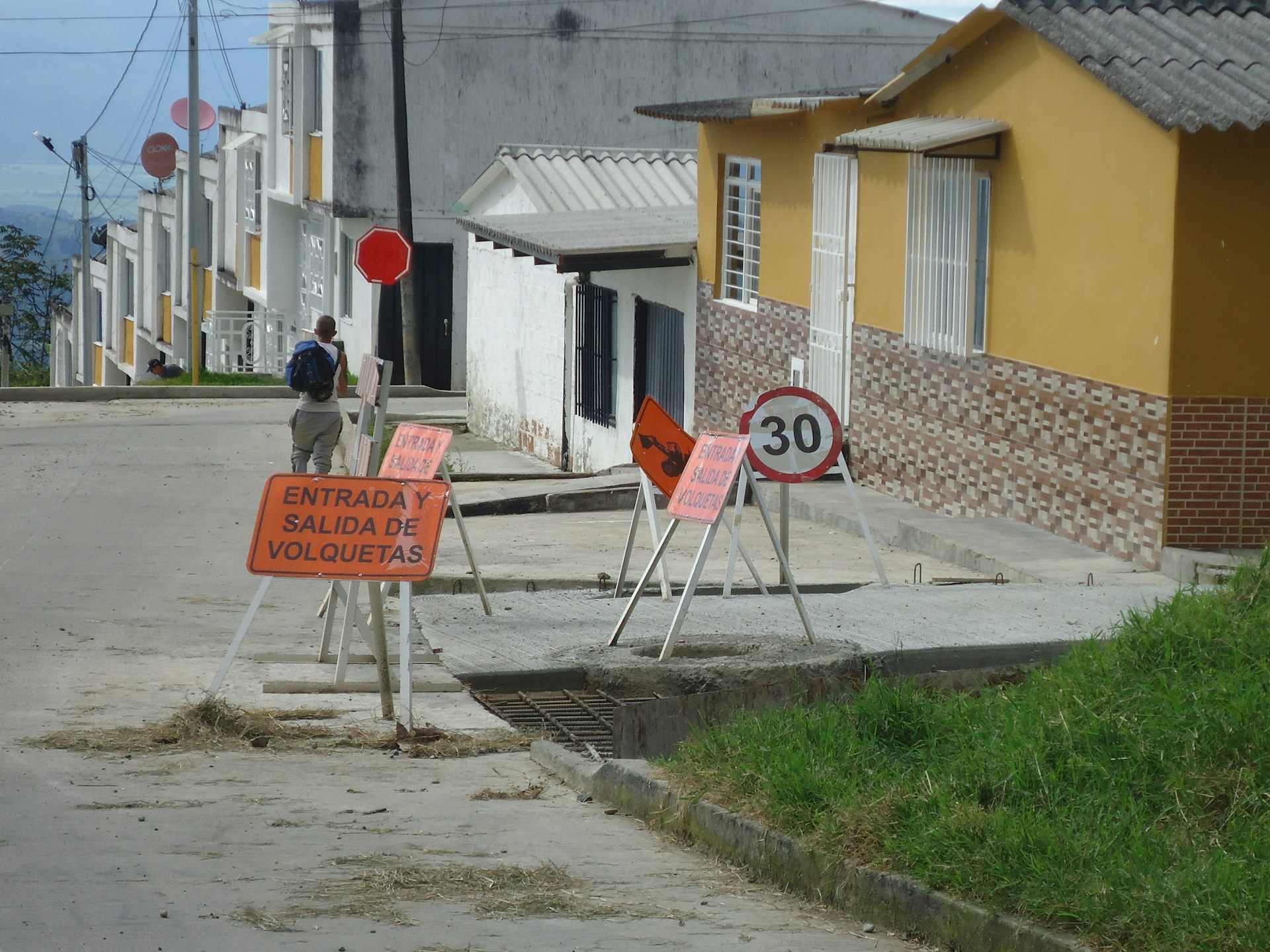 woman wearing yellow long-sleeved dress under white clouds and blue sky during daytime