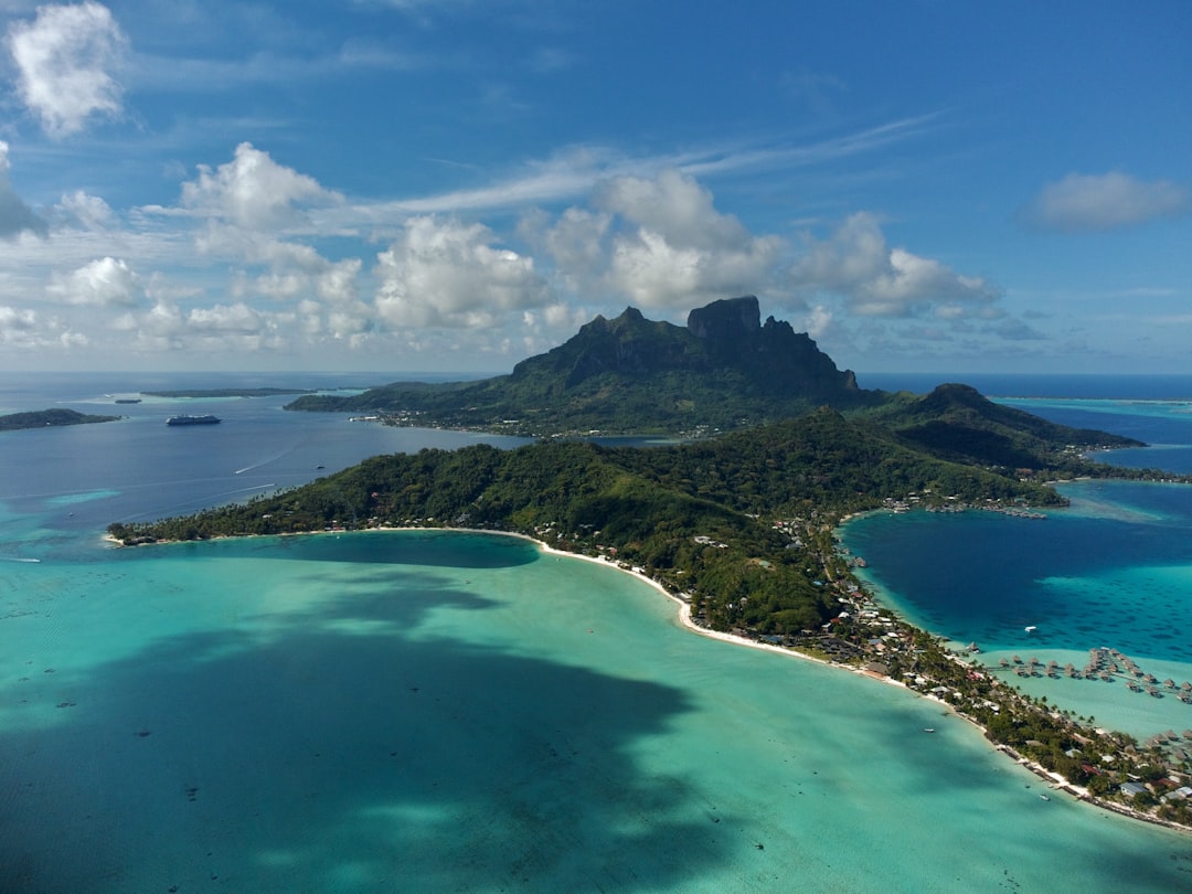 an aerial view of an island in the middle of the ocean,