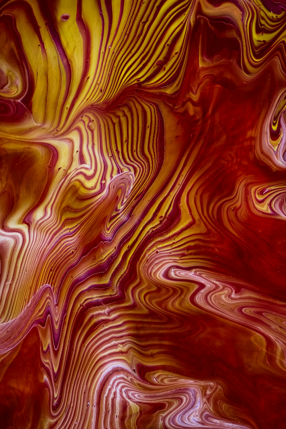 a close up of a red and yellow swirl