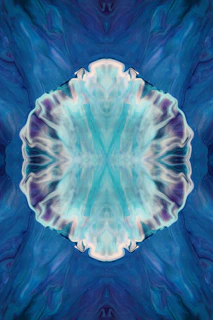 A dark blue and turquoise abstract pattern resembling sound waves in space
