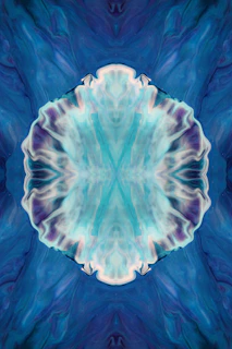 A dark blue and turquoise abstract pattern resembling sound waves in space