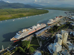 a cruise ship docked in a harbor next to a city