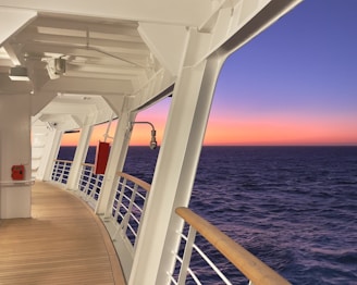 the deck of a cruise ship at sunset