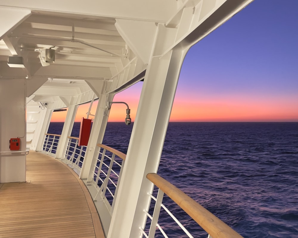 the deck of a cruise ship at sunset