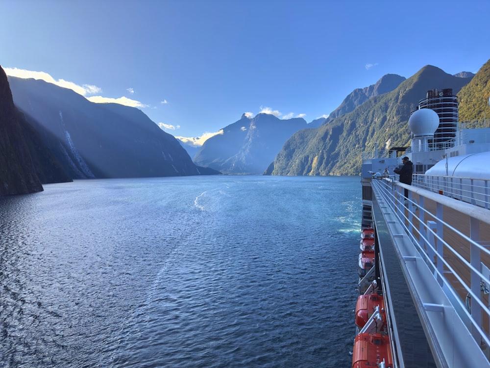 a large body of water with mountains in the background