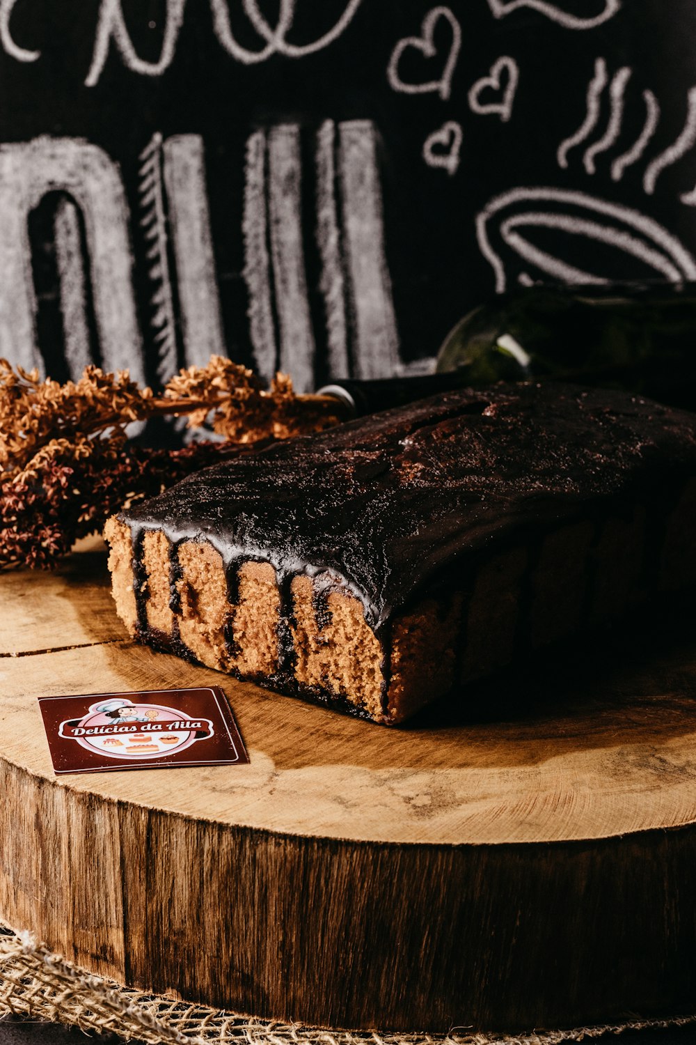 a piece of cake sitting on top of a wooden cutting board