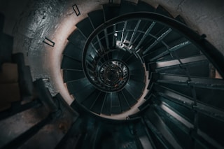 a spiral staircase in a concrete building
