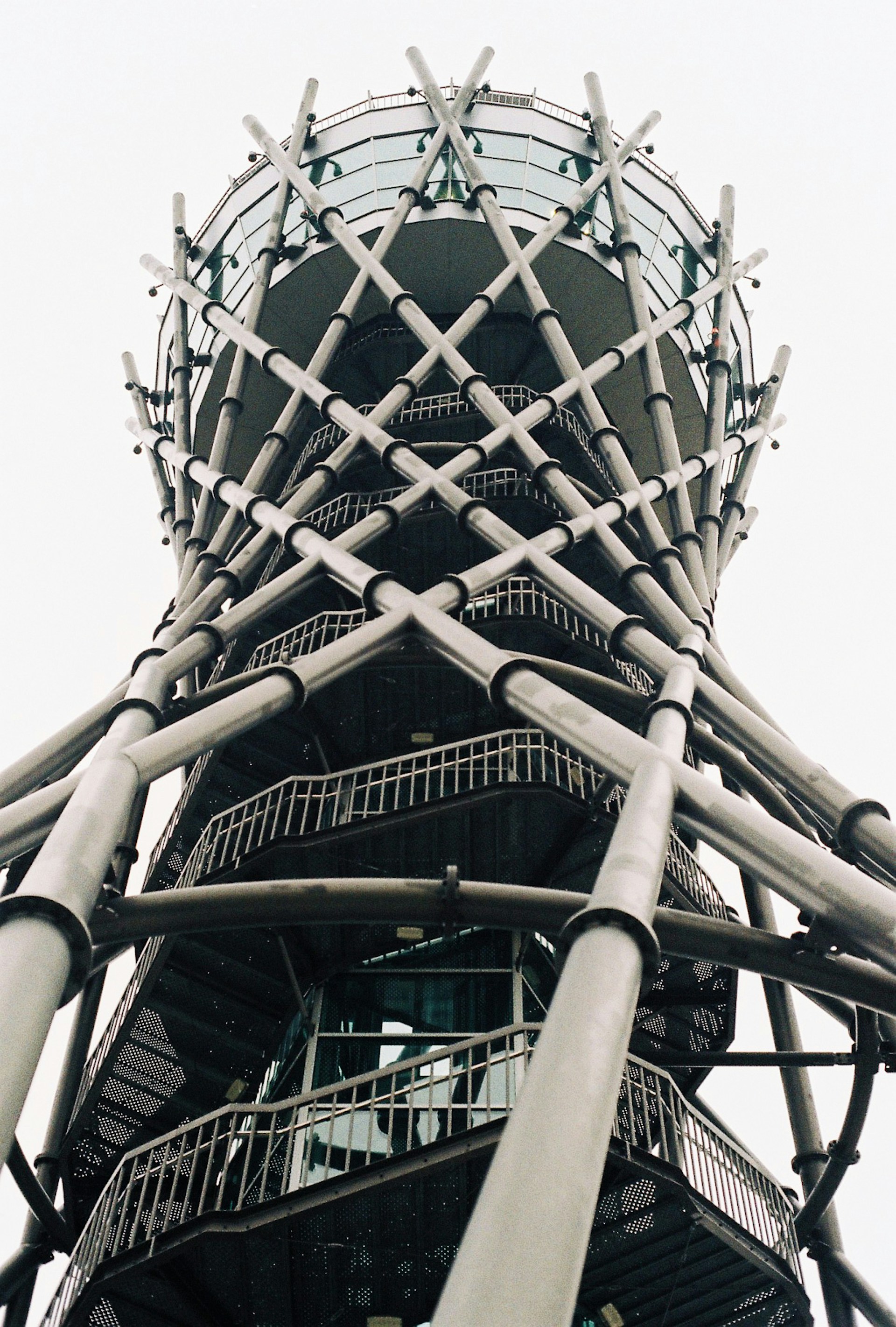 a very tall metal structure with lots of windows