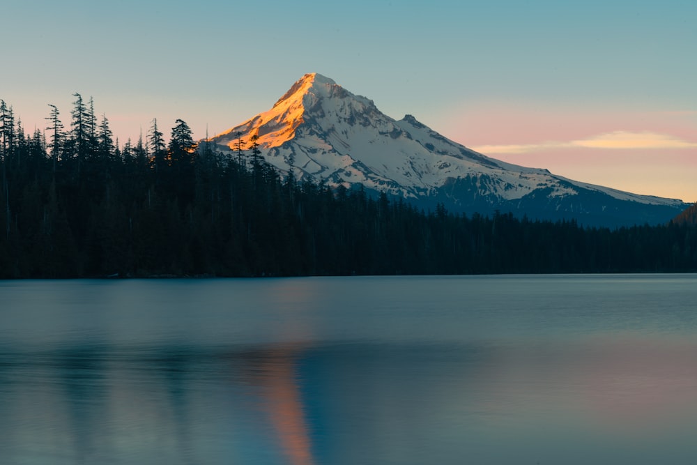 a mountain with a reflection in the water