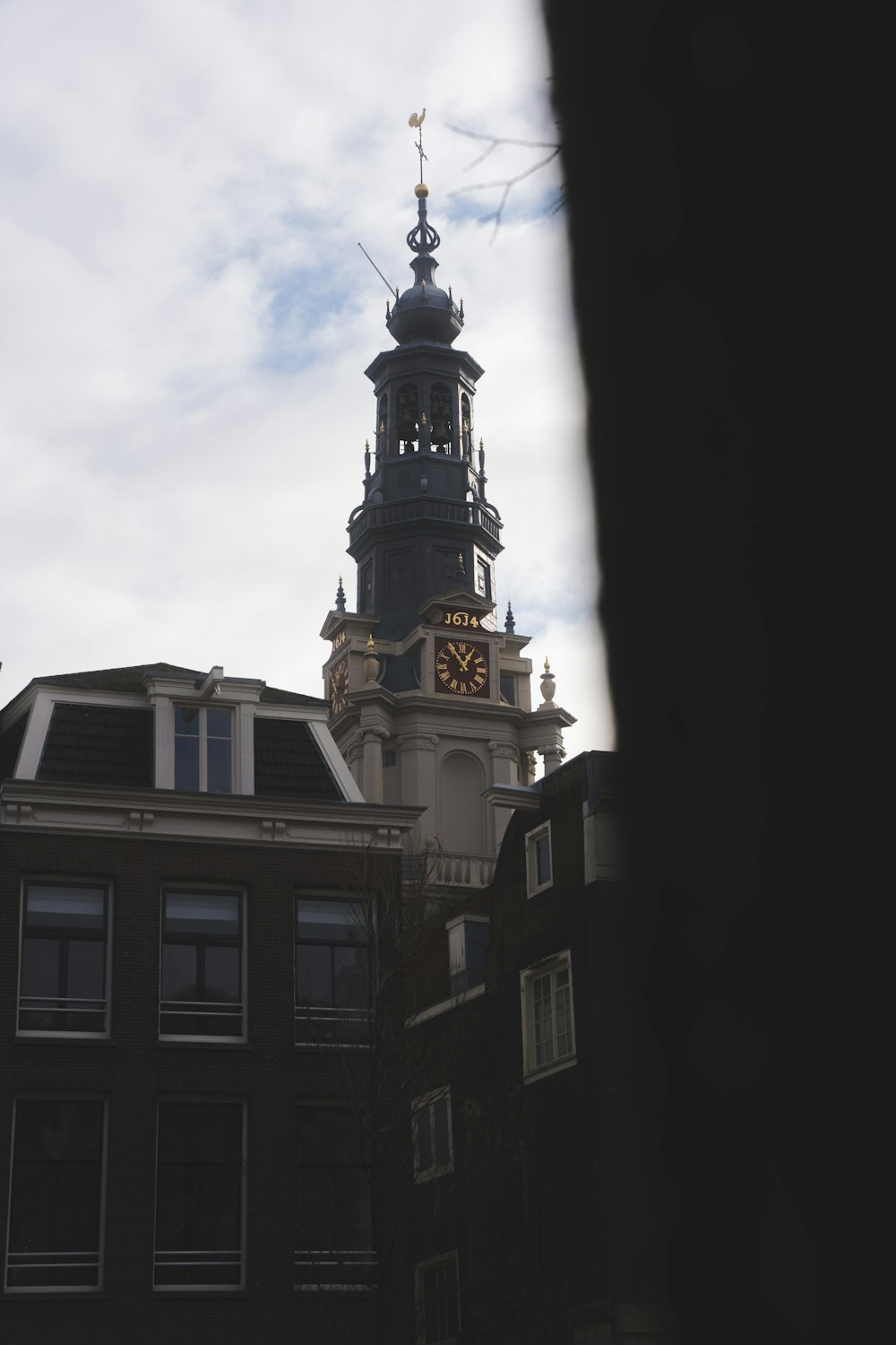 a tall clock tower towering over a city