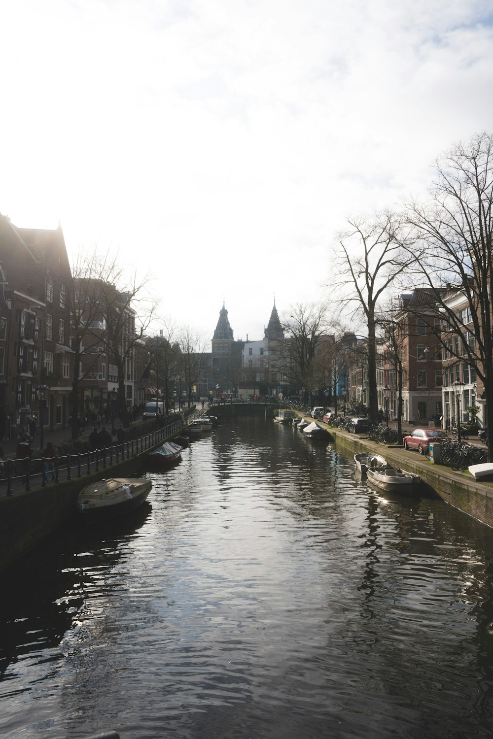 a river running through a city next to tall buildings