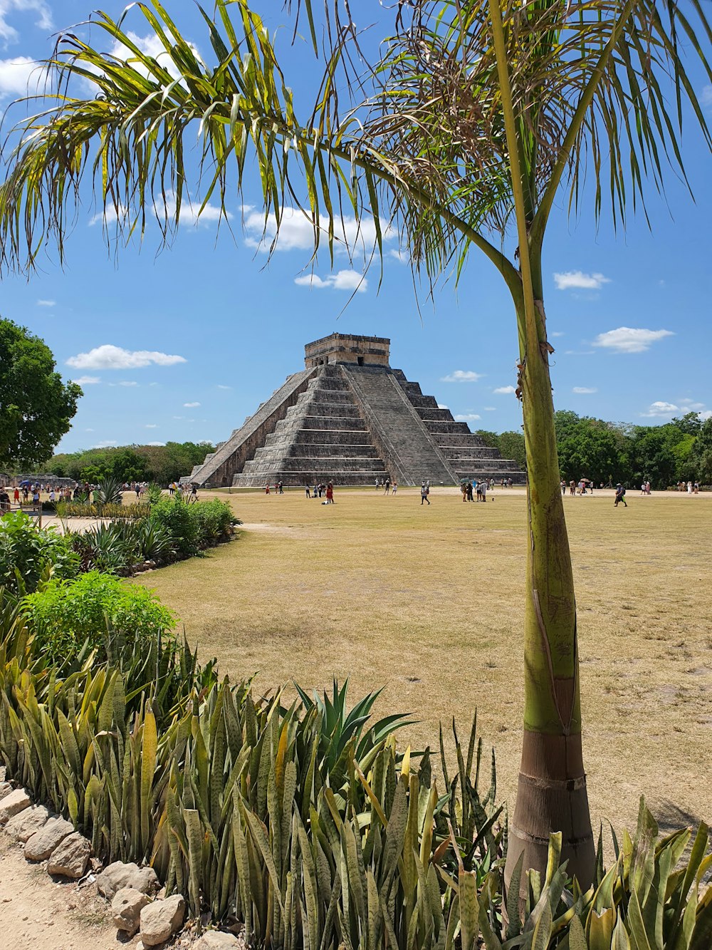 a large pyramid in the middle of a field