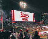 The team celebrating a hard-fought victory under the bright stadium lights.