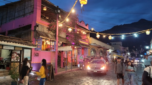 A vibrant street scene in Tepoztlán with colorful buildings and locals enjoying the day.