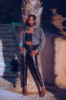 Close-up of a model wearing a sleek miami84 casual jacket with palm tree shadows in the background.