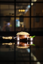 A warm, inviting kitchen scene with a pot of steaming biryani ready to be served.